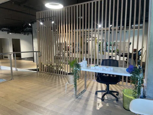 The reception desk of an Align Health Collective clinic, behind a floor-to-ceiling timber screen.